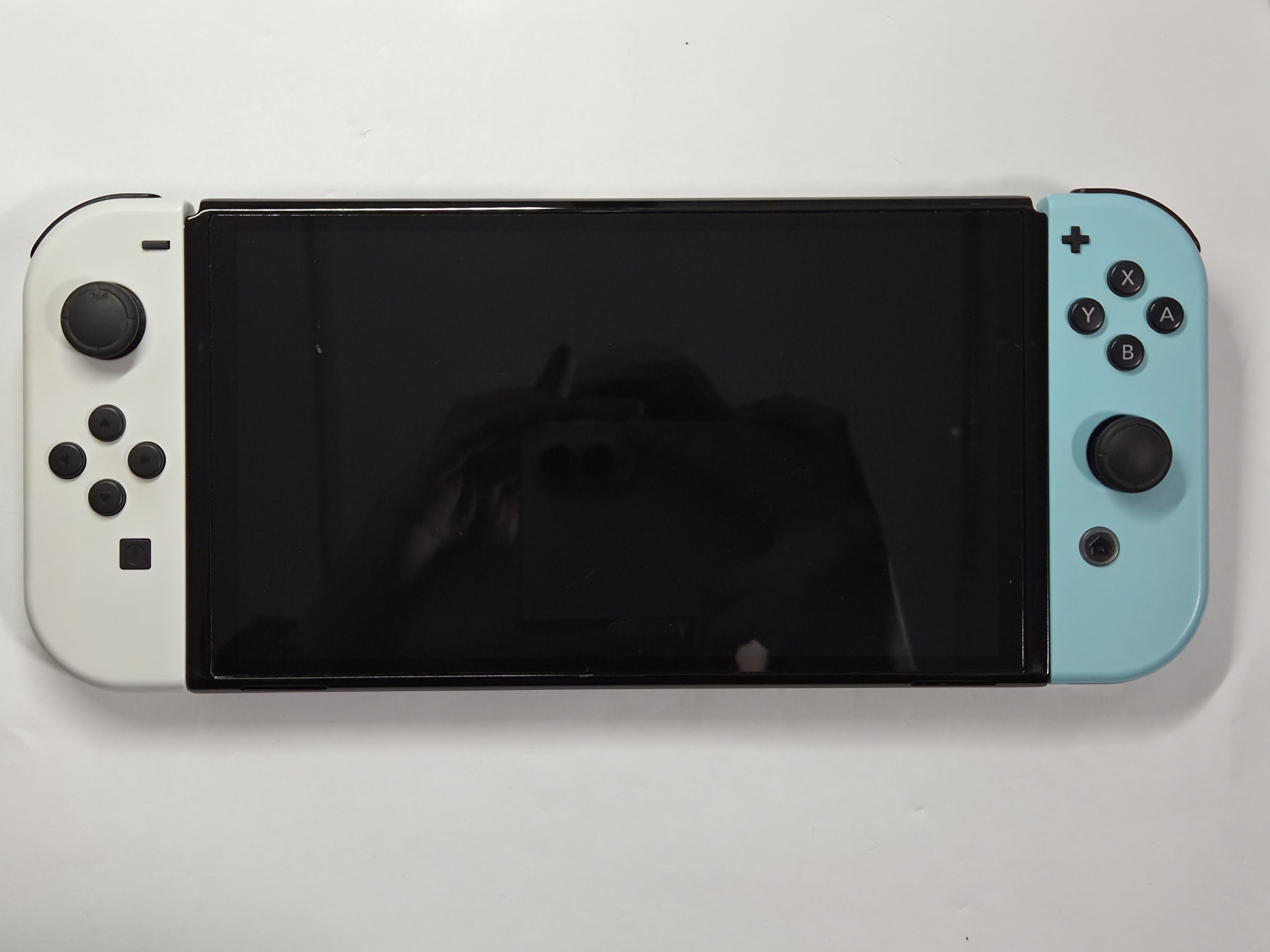 Nintendo Switch OLED · Black · 64 GB · Used · Excellent — photo 2 of 3